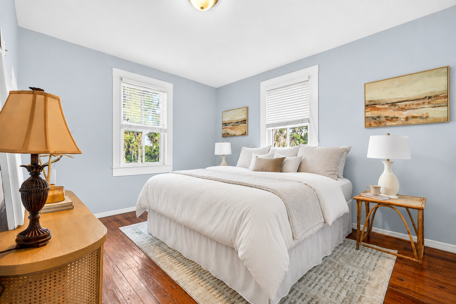 Staged primary bedroom with soft blue walls, Dade City